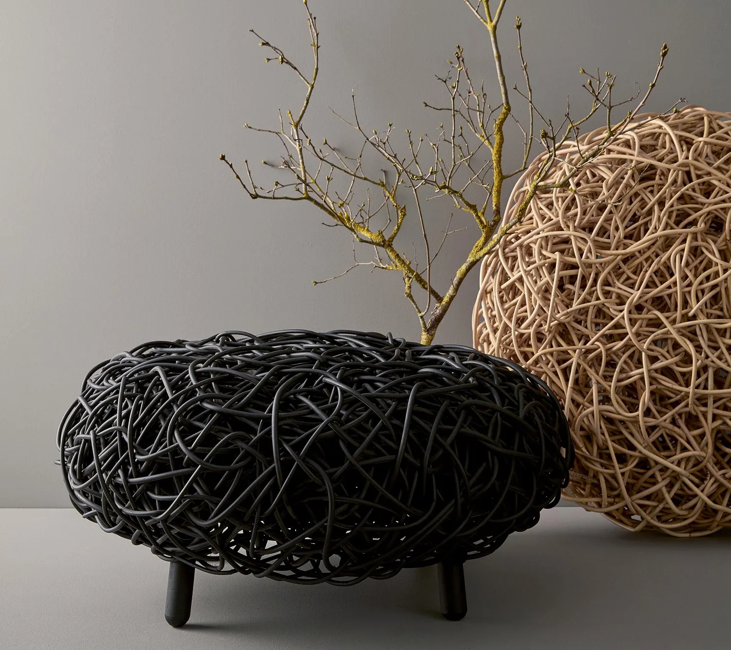 Cane-Line Loop fodskammel rattan sort indendørs